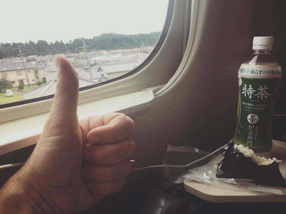 On my way to Fukuoka by Shinkansen, having cold green tea and yummy onigiri