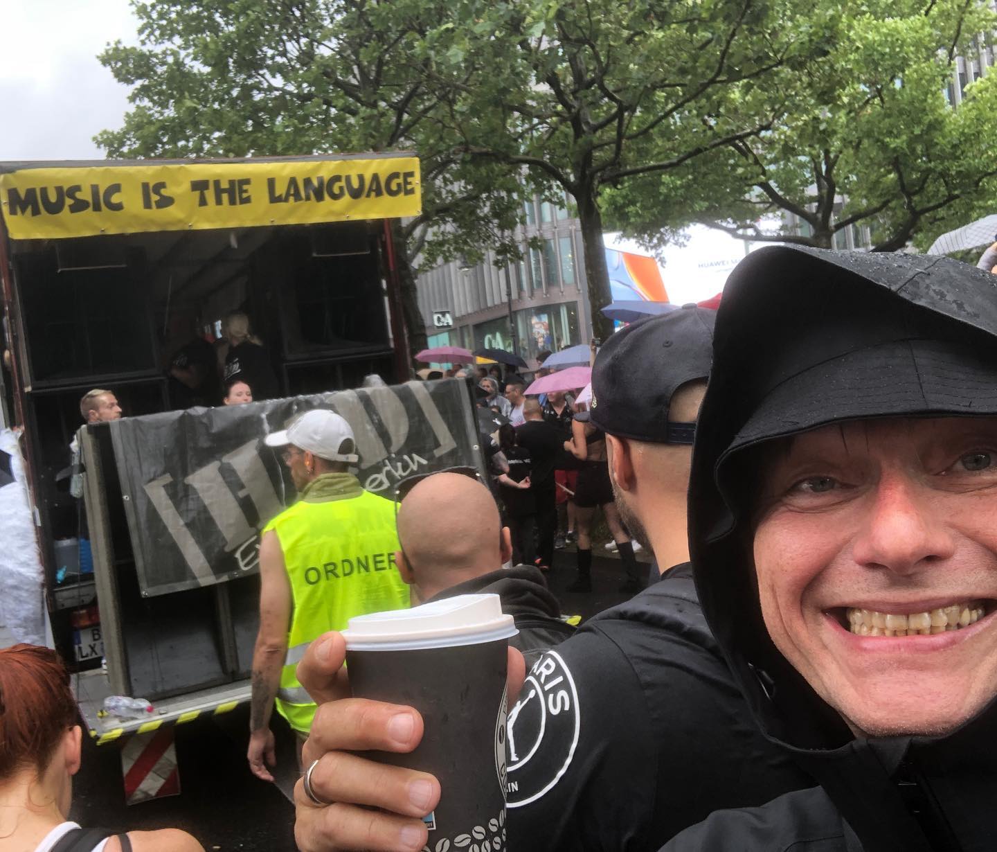 Me approaching the #derweißehase float with a very much needed coffee and a …