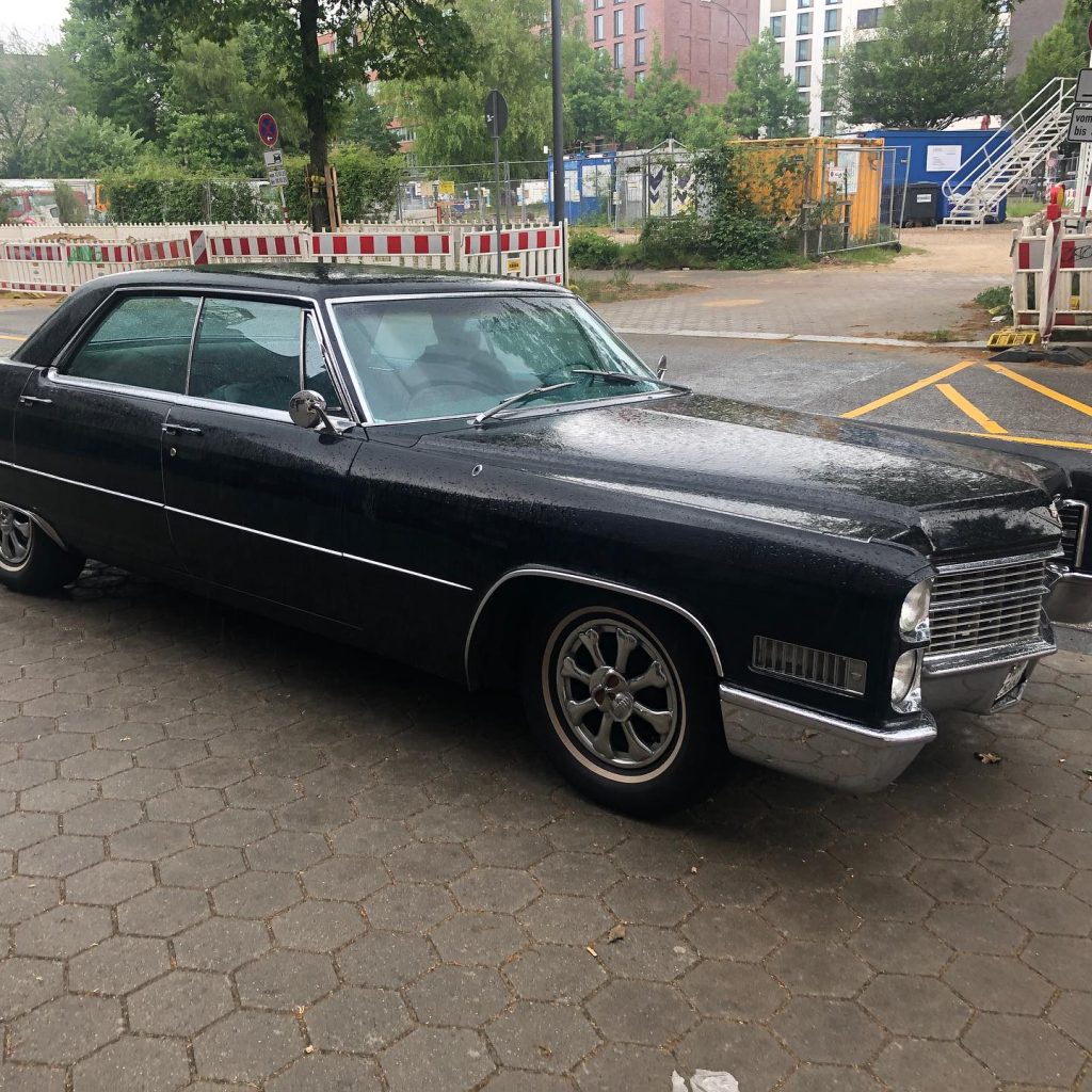 Driven by passion - and @sevencarstens black and long Cadillac Sedan de Ville …